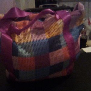 A very big multi-colored purse